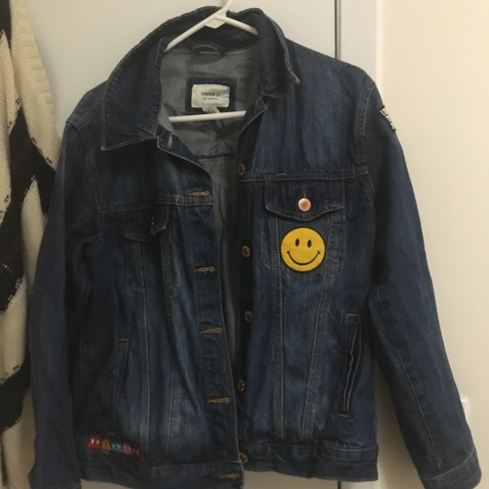 Denim jacket with patches hand sewn on